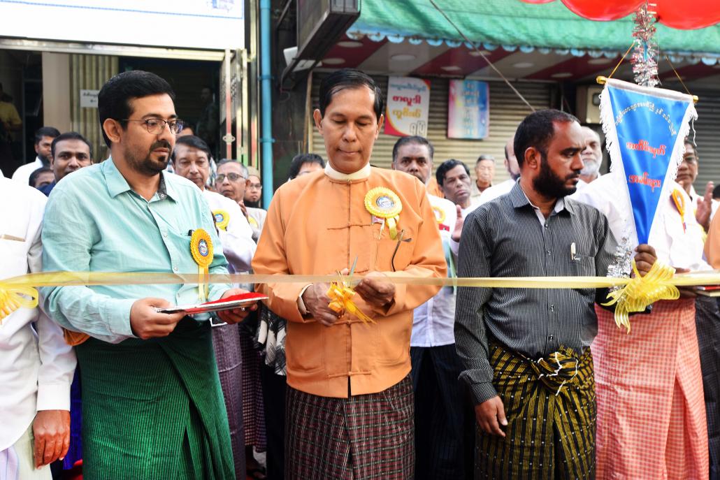 NLD MP U Ba Myo Thein, centre, cuts a ribbon during a ceremony on February 4 to mark the 160th anniversary of the Cholia Jamah Mosque in Yangon. (Steve Tickner | Frontier)