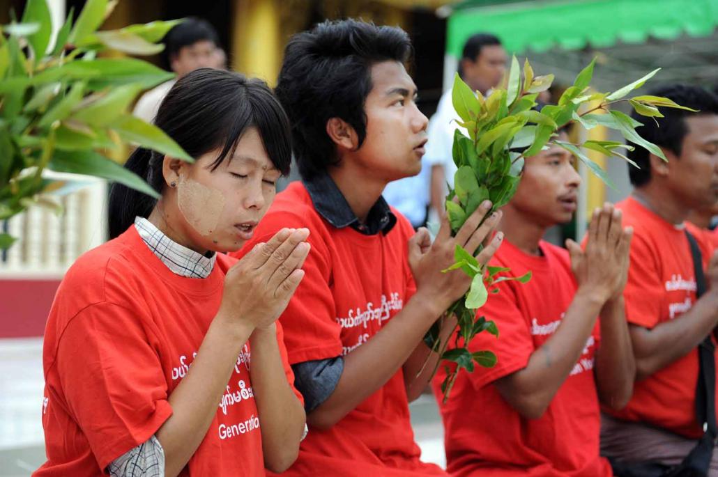 Activists pray for peace at Shwedagon Pagoda. (Steve Tickner / Frontier)