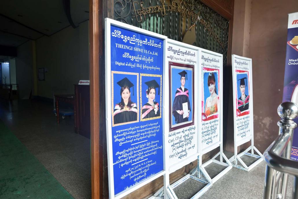 Theingi Shwe Yi advertises its services to university graduates. The company has held an annual contract for graduation photos at Yangon University since the mid-1990s. (Steve Tickner | Frontier)