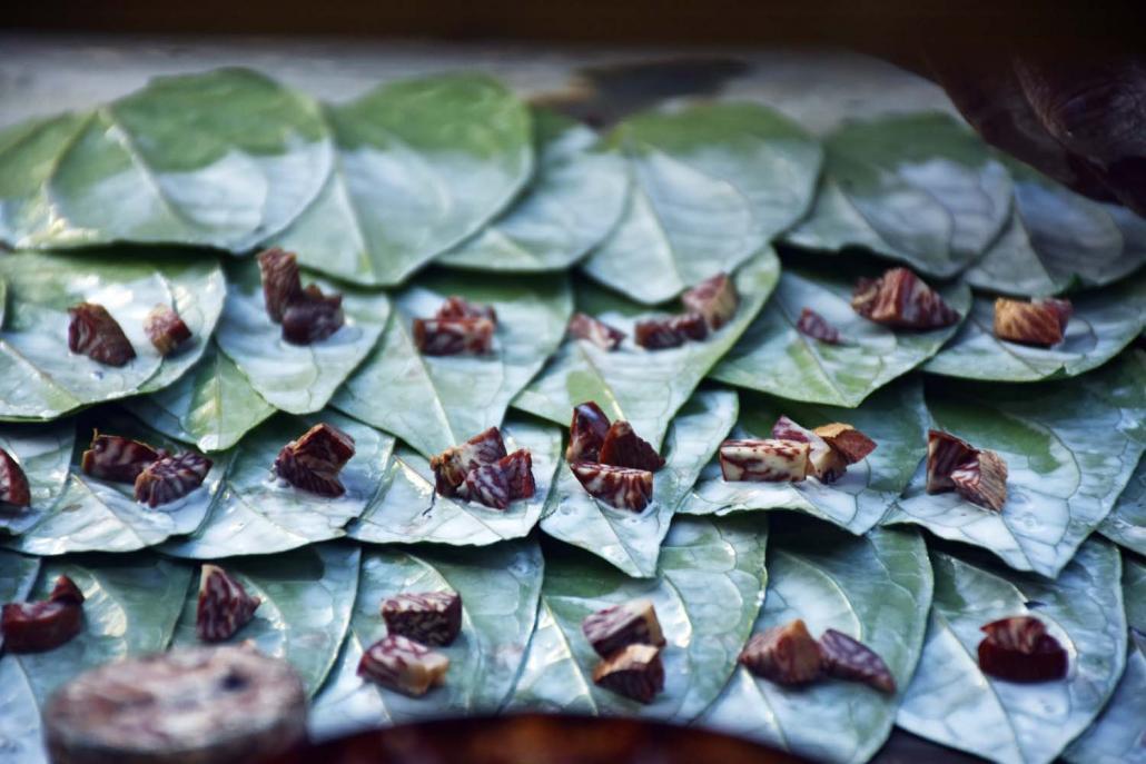 Quids of betel nut are lined up for sale in Yangon. Although a pack of five sells for just K200, vendors can make K50,000 or more a day. (Steve Tickner | Frontier)