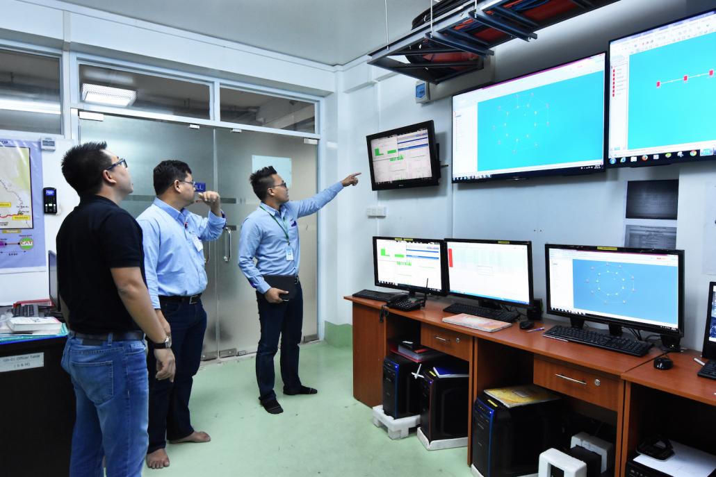 Staff at the Global Technology headquarters in Yangon. (Steve Tickner | Frontier)