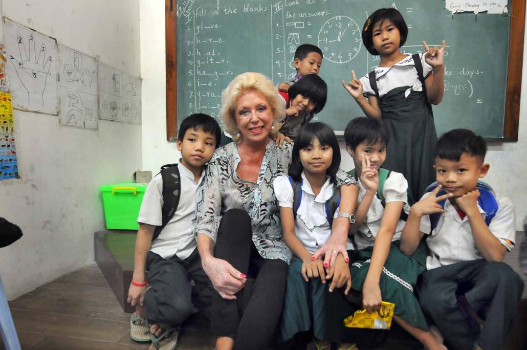 Ms Pamela McCourt Francescone with students at the Mary Chapman School for the Deaf in Yangon. (Steve Tickner / Frontier)