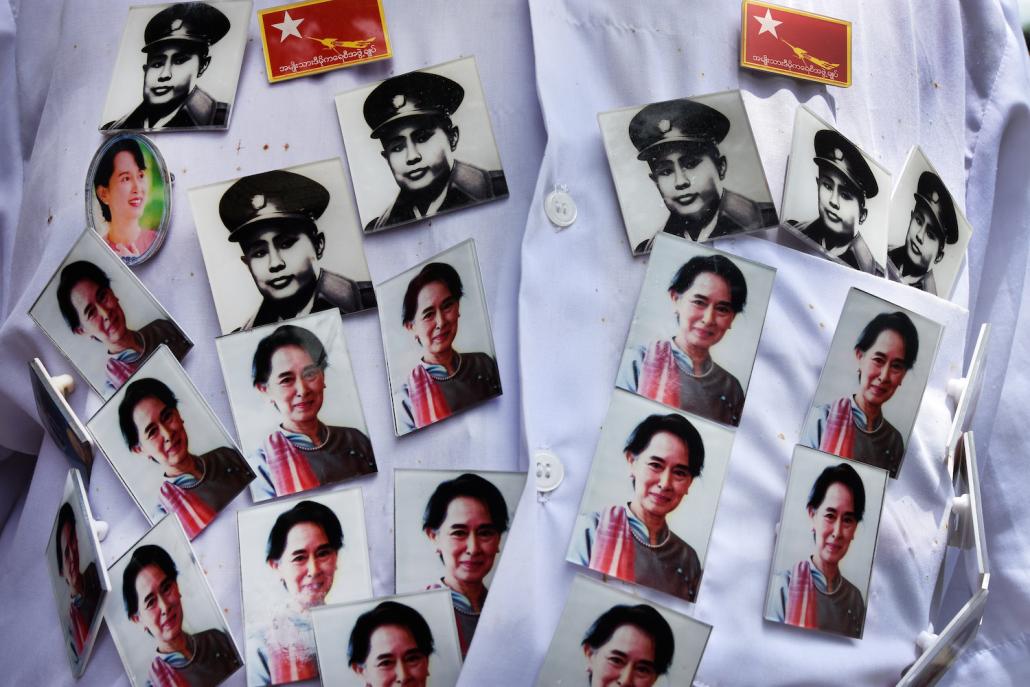 A supporter of Generation 88 wears General Aung San and Daw Aung San Suu Kyi badges at Yangon University. (Steve Tickner | Frontier)