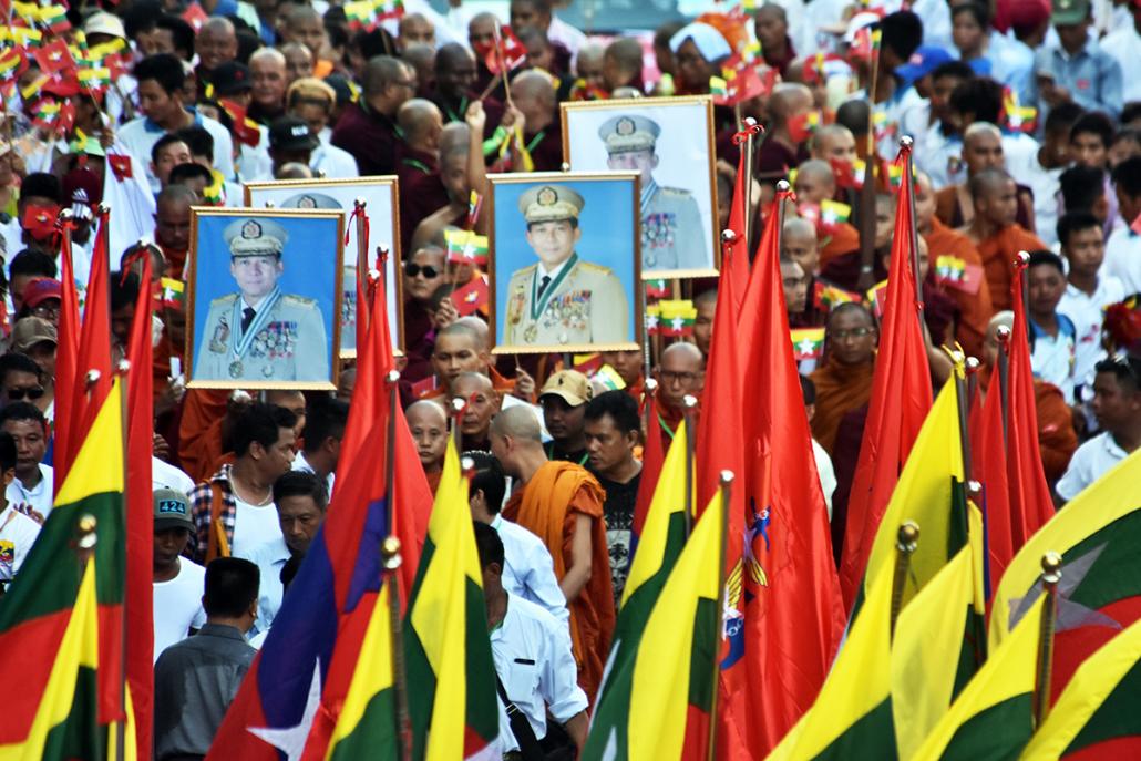 protestors marched south toward downtown Yangon’s Maha Bandoola Park, waving Myanmar and Tatmadaw flags and holding up framed portraits of Senior General Min Aung Hlaing. (Steve Tickner | Frontier)