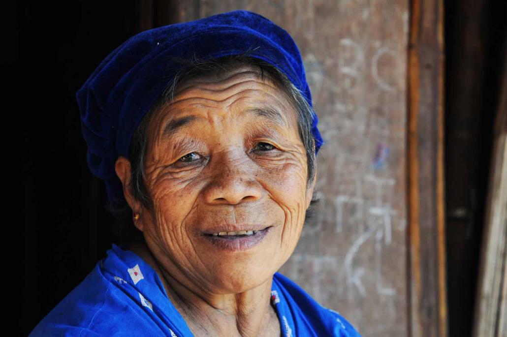 Marip Lu, an 80 year old ethnic Kachin woman, sits outside her home in the Woi Chyai IDP camp in Laiza. (Steve Tickner / Frontier)