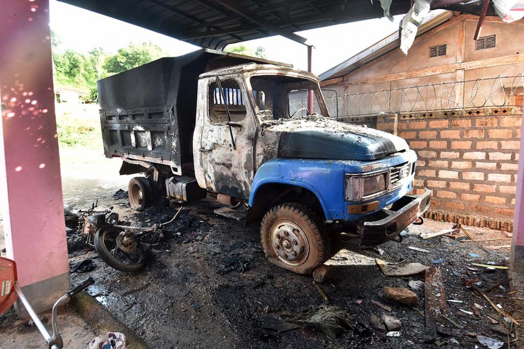 A truck and motorcycle destryoed during the assault on the home of Mai Yan militia leader U Win Maung. (Steve Tickner | Frontier)