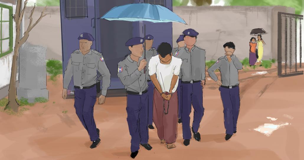 Michael Kyaw Myint is escorted by police officers into North Dagon Township court. (Jared Downing | Frontier)