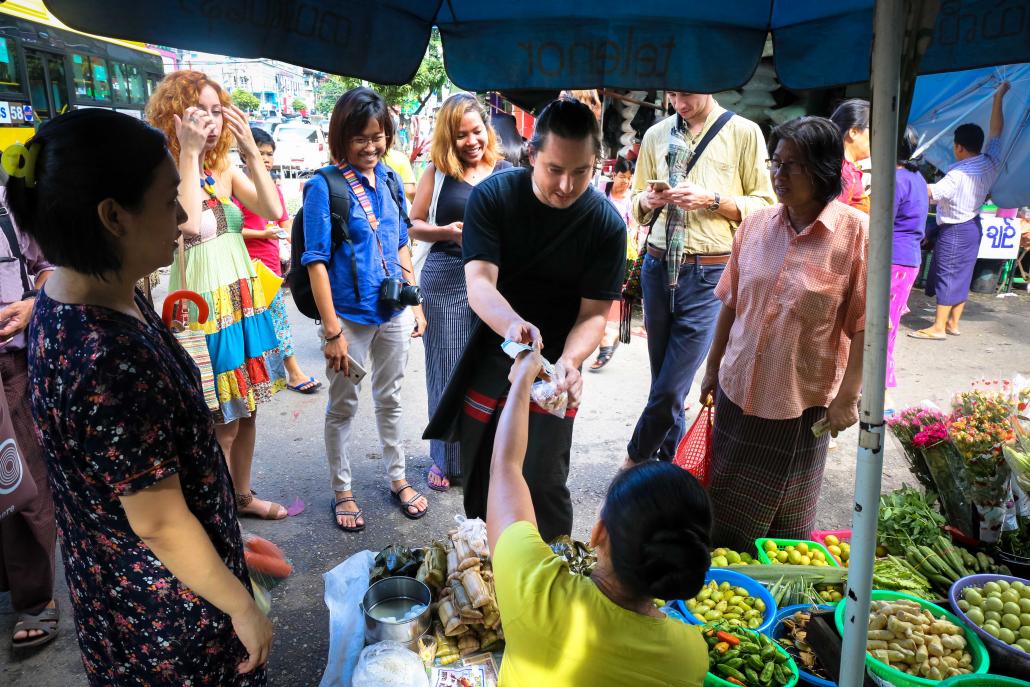 Yangon tours tend to focus on the city’s religious and colonial-era buildings, but Sa Ba Tours gives visitors the chance to find the best food on offer. (Victoria Milko | Frontier)