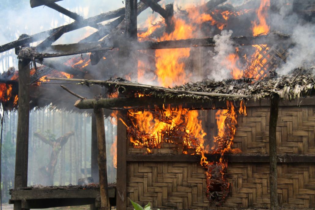 A home in Gawduthara village ablaze on the afternoon of September 7. (Nyan Hlaing Lynn | Frontier)