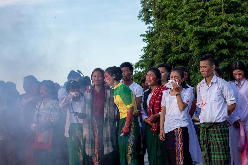 IDP youth shed tears while watching a re-enactment of an aerial bombing at the event held in Myitkyina on June 9. (Phoe Shane | Frontier)