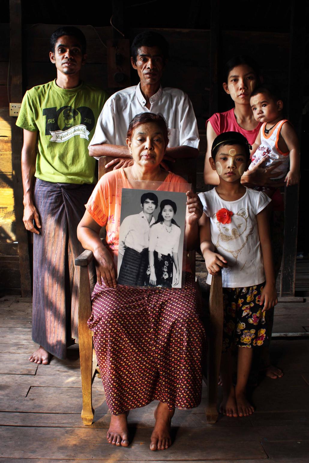 The family of U Aung May Thu, a National League for Democracy activist who died in Yangon General Hospital in 2002 after more than a decade in prison. (Letyar Tun / Framing the Transition)