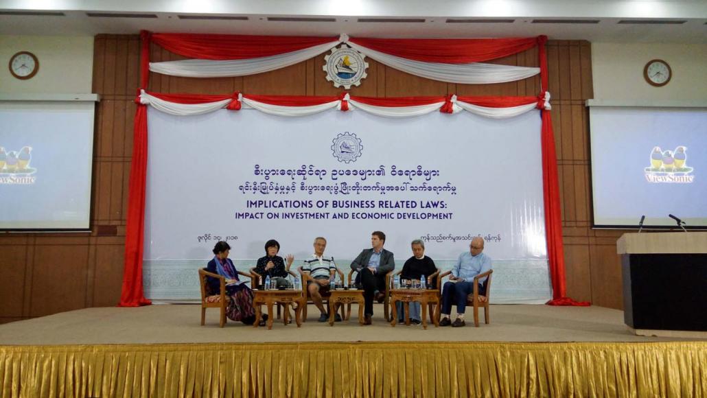 Panellists speak at a seminar focused on the draft labour law and other business-related laws held at the UMFCCI on July 14. (Kyaw Lin Htoon | Frontier)