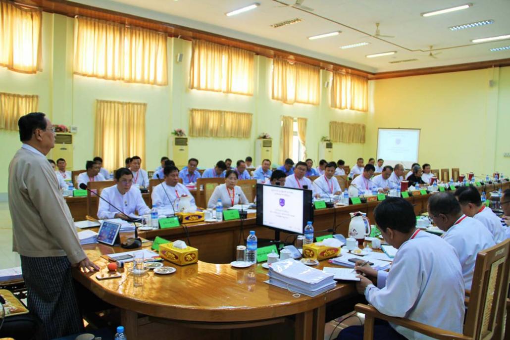 Minister for Electricity and Energy U Win Khaing leads a meeting at the ministry on August 7, two days after returning to work following a period of medical leave. (MOEE Facebook)