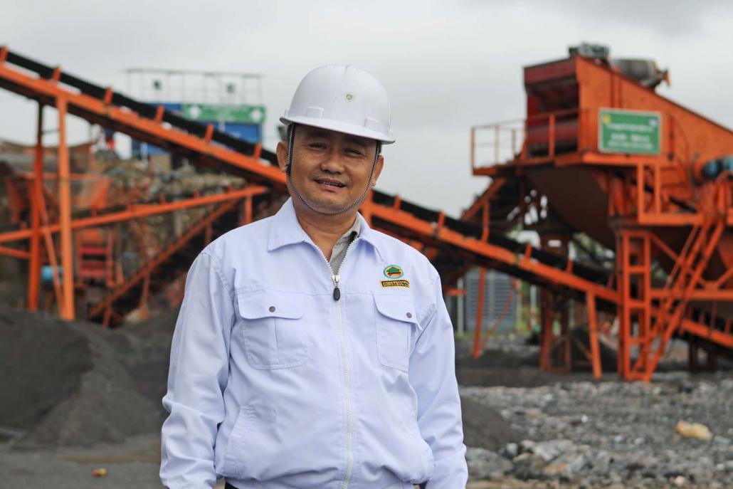 Department of Highways director U Thaung Soe Han stands in front of the silent China Road and Bridge Corporation quarry at Mt Lun Nya near Hpa-an. (Thomas Kean | Frontier)