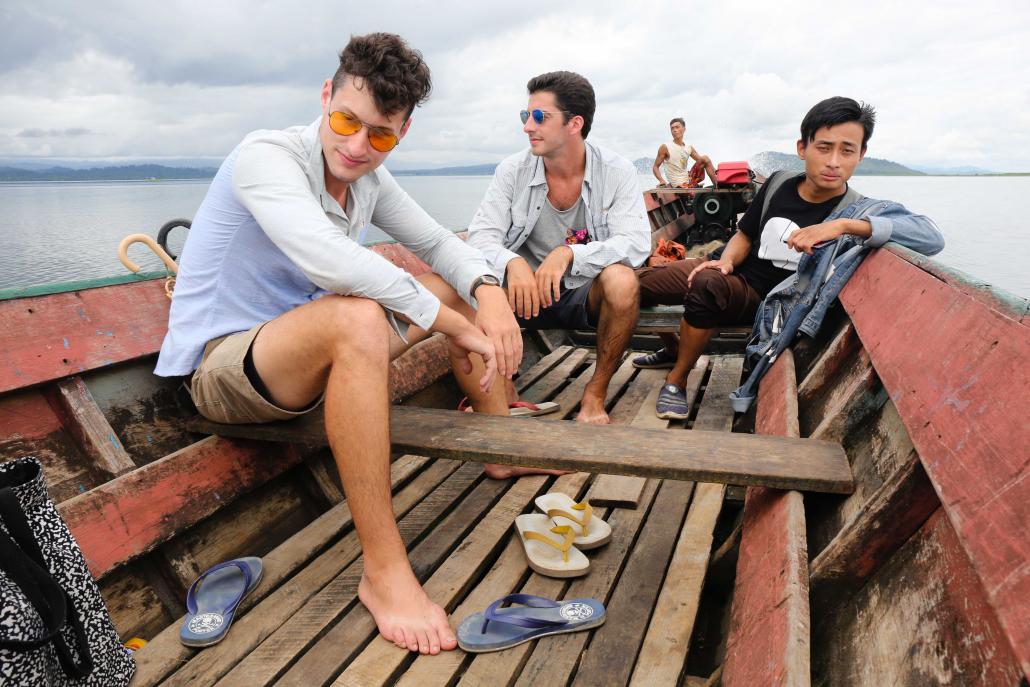 Face of Indawgyi founders Stephen Traina-Dorge and Patrick Compton take a boat around the lake to collect rubbish bins distributed to local villages. (Victoria Milko | Frontier)