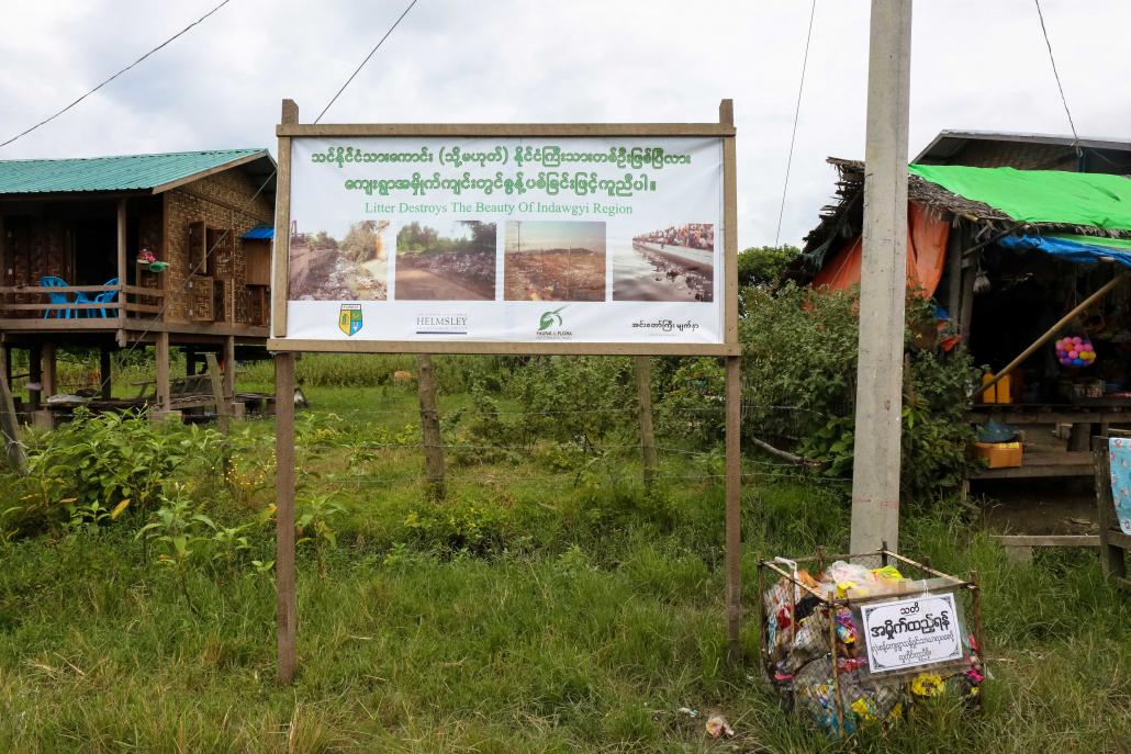 Since Thingyan Face of Indawgyi has been working with villagers in Lonsant to make lightweight, portable rubbish bins out of old fishing nets. The bins have been distributed to villages around Indawgyi. (Victoria Milko | Frontier)