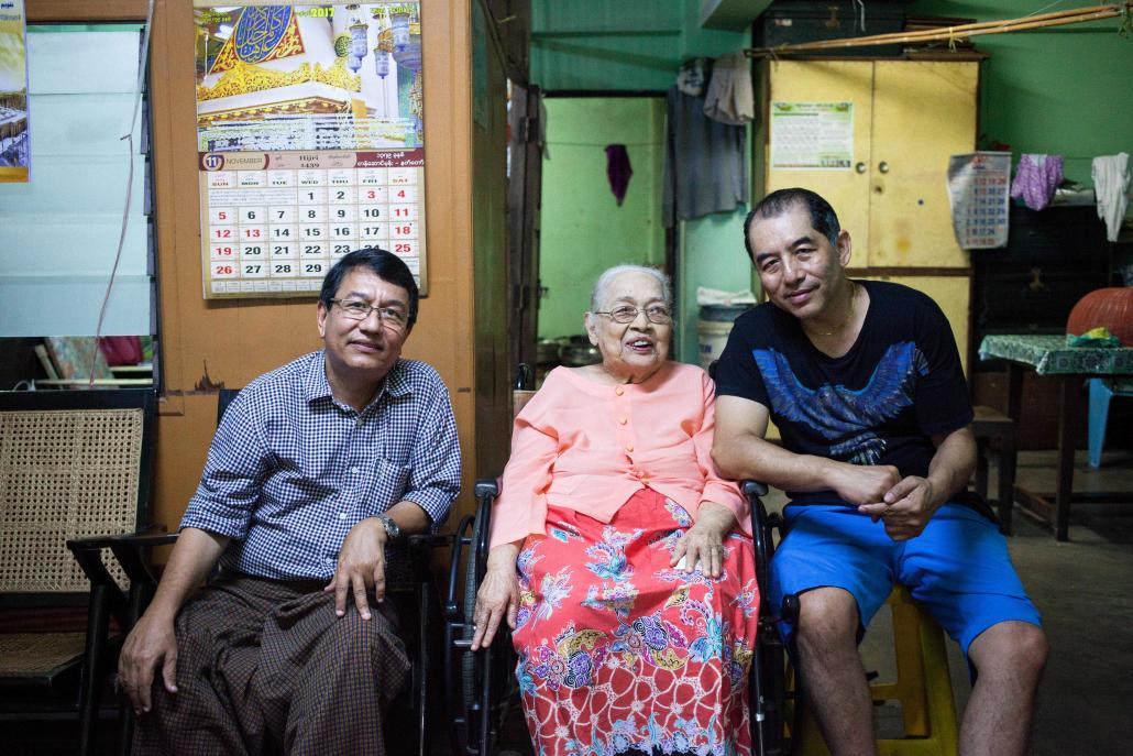 Khin Maung Htoo, Daw Thant Myint and her grandson Andrew Soe at her apartment in Mingalar Taung Nyunt Township. (Theint Mon Soe aka J | Frontier)