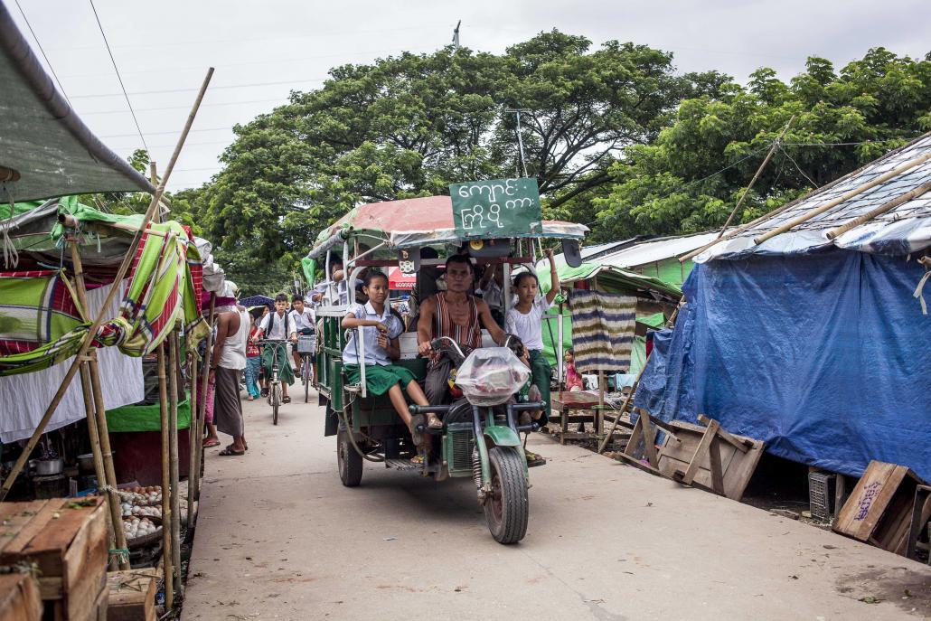 Residents of the Dagon Seikkan community pay a one-off fee of K30,000 to K50,000, which is used to provide basic services. (Theint Mon Soe aka J | Frontier)