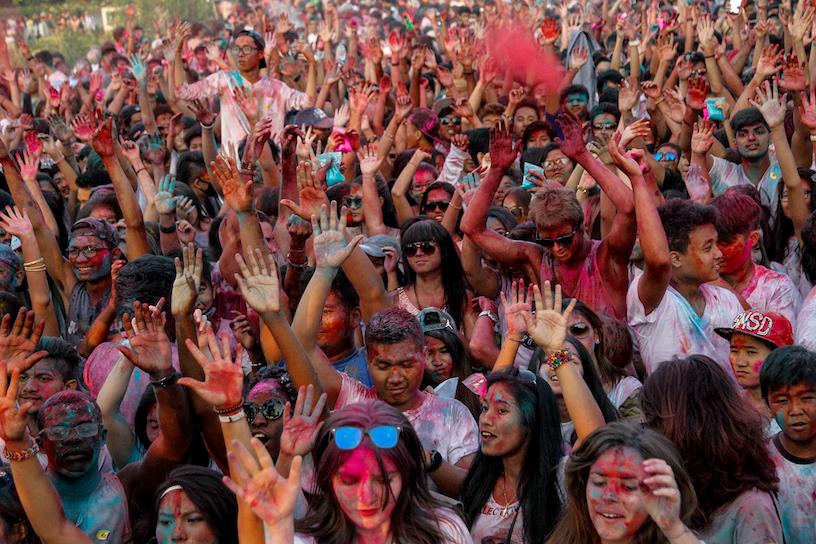 Young people celebrate at the Myanmar Colour Festival in Yangon. (Theint Mon Soe / Frontier)