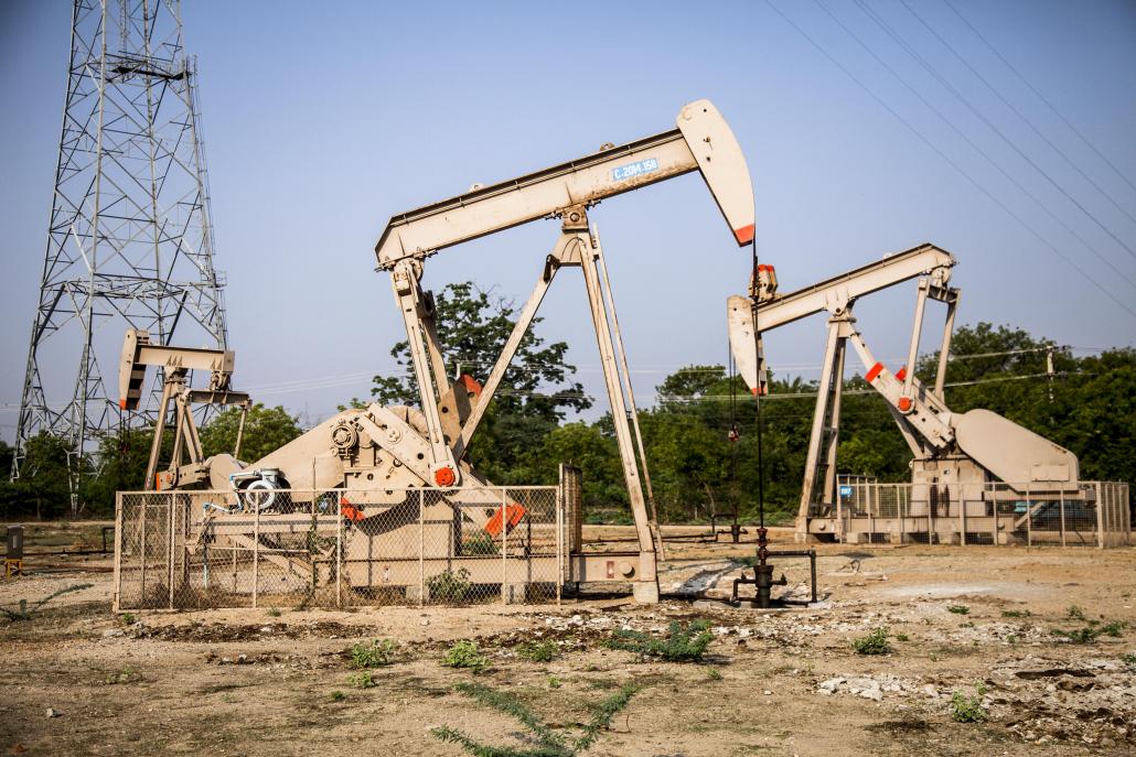 Derricks pump oil in Magway. An investigation has found that K7.549 billion in oil taxation revenue from the fields is missing from government coffers. (Theint Mon Soe aka J | Frontier)