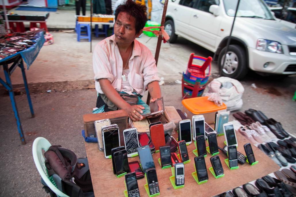 Ownership of hand phones has boomed since the telecoms industry was liberalised in 2013. (Theint Mon Soe - J / Frontier)