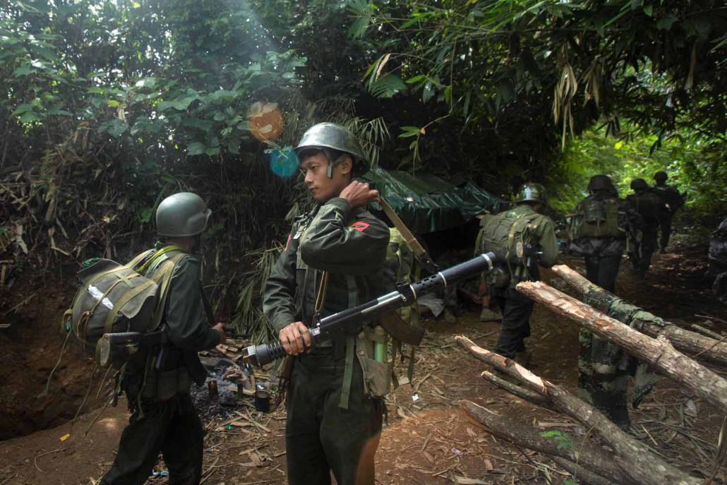 Kachin Independence Army soldiers move toward the frontline near Laiza in Kachin state. (AFP)