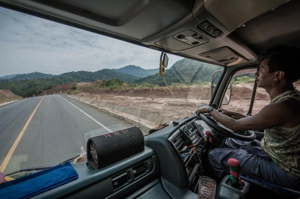 A trucker plies the new Asia Highway route in Kayin State. (Ko Taik / Frontier)