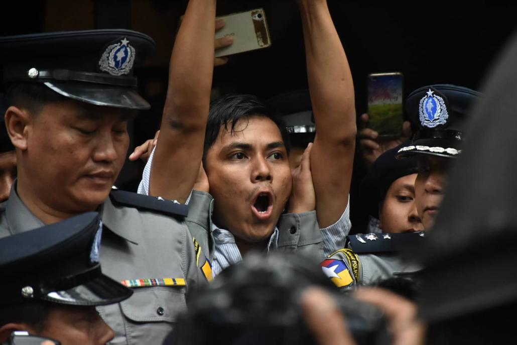 Reuters journalist Kyaw Soe Oo is led out of the Yangon Northern District court and back to prison. (Steve Tickner | Frontier)