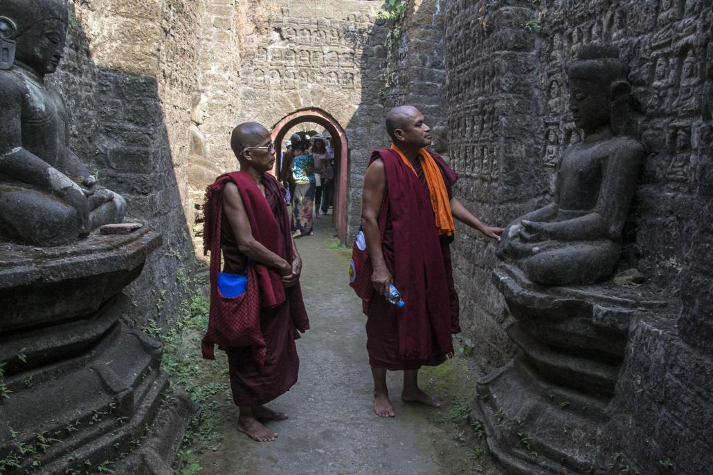 Monks inspect ruins in Mrauk U. (Mratt Kyaw Thu / Frontier)