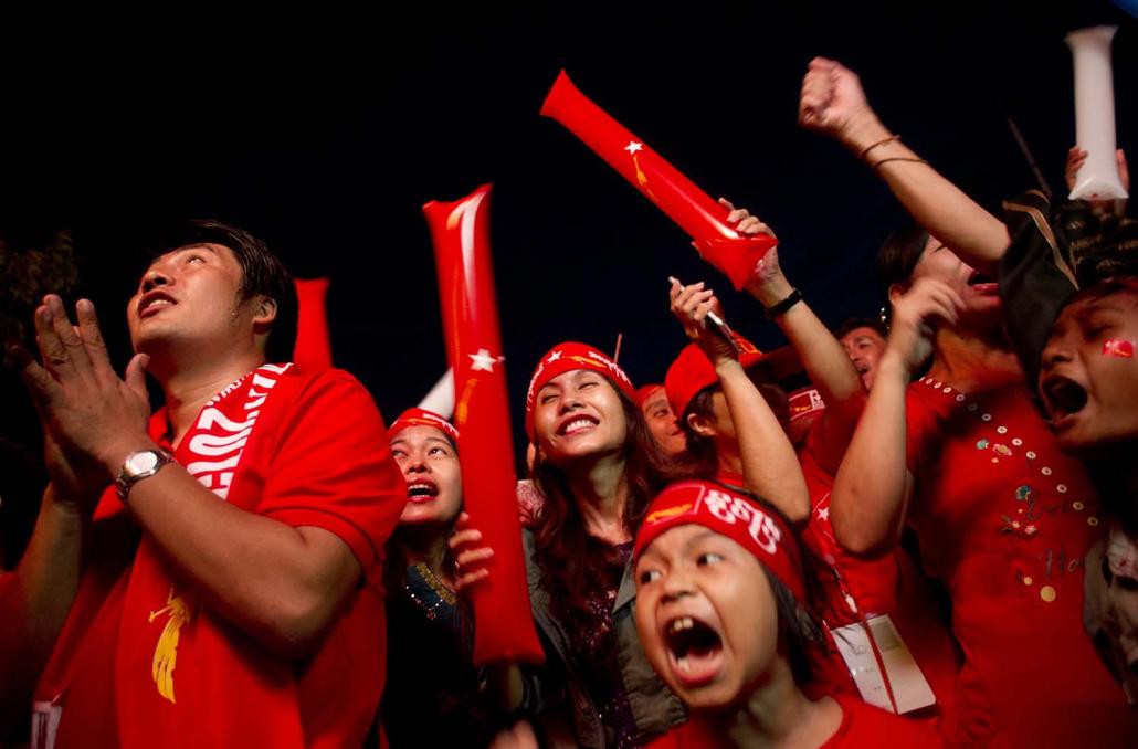 National League for Democracy supporters celebrate the announcement of election results outside the party's headquarters in Yangon on November 9, 2015. (AFP)