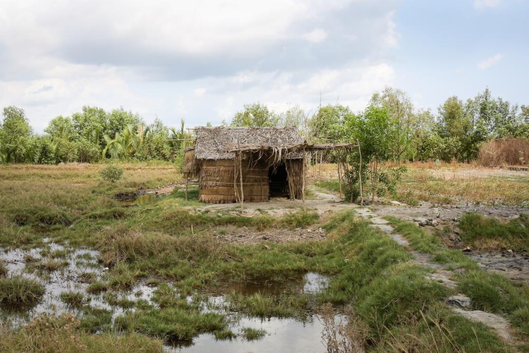 A house on the side of the road in Labutta Township. Most villages in the area have shrunk in population, as many of those who survived the storm moved away. (Victoria Milko | Frontier)