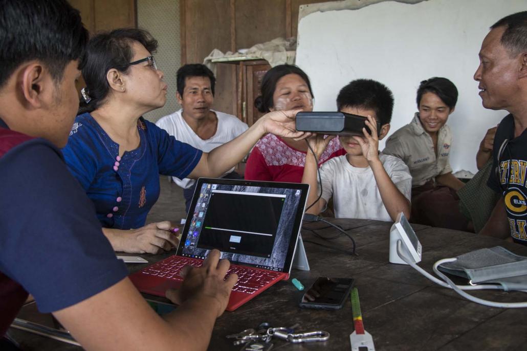 Shwepyithar residents register for a health insurance card. (Nyein Su Wai Kyaw Soe | Frontier)