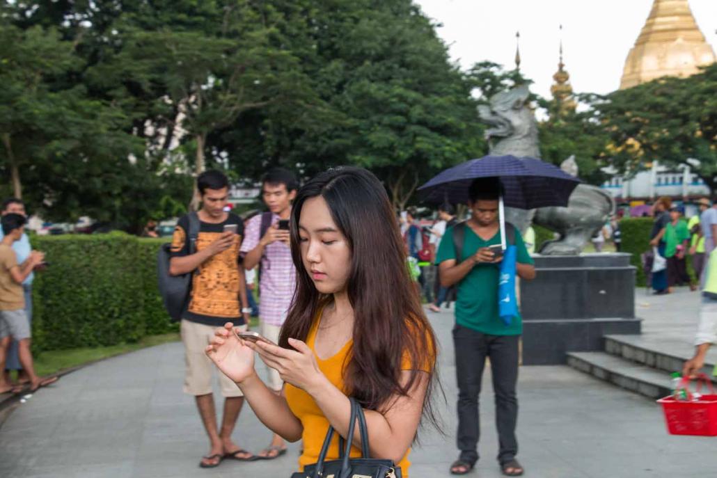 Phone use has skyrocketed since new operators launched in 2014, with more than 50 million active SIMs and a fourth operator poised to enter the market. (Nyein Su Wai Kyaw Soe / Frontier)