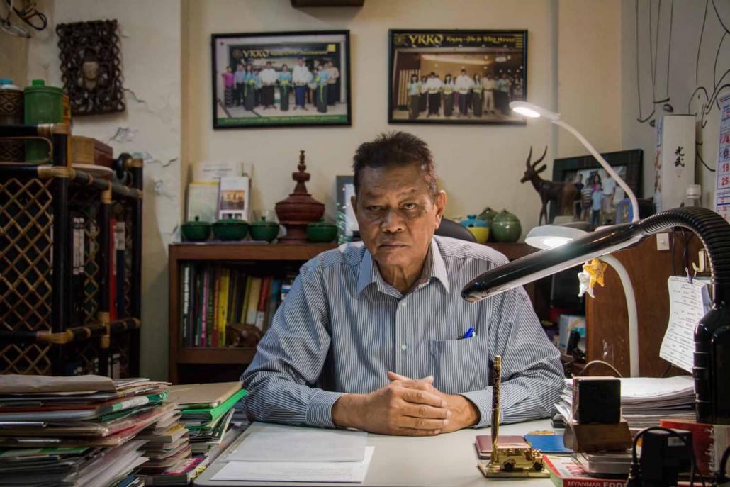 U Sonny Aung Khin in his office, surrounded by photos and other mementoes collected during more than 50 years in the tourism industry. (Nyein Su Wai Kyaw Soe / Frontier(