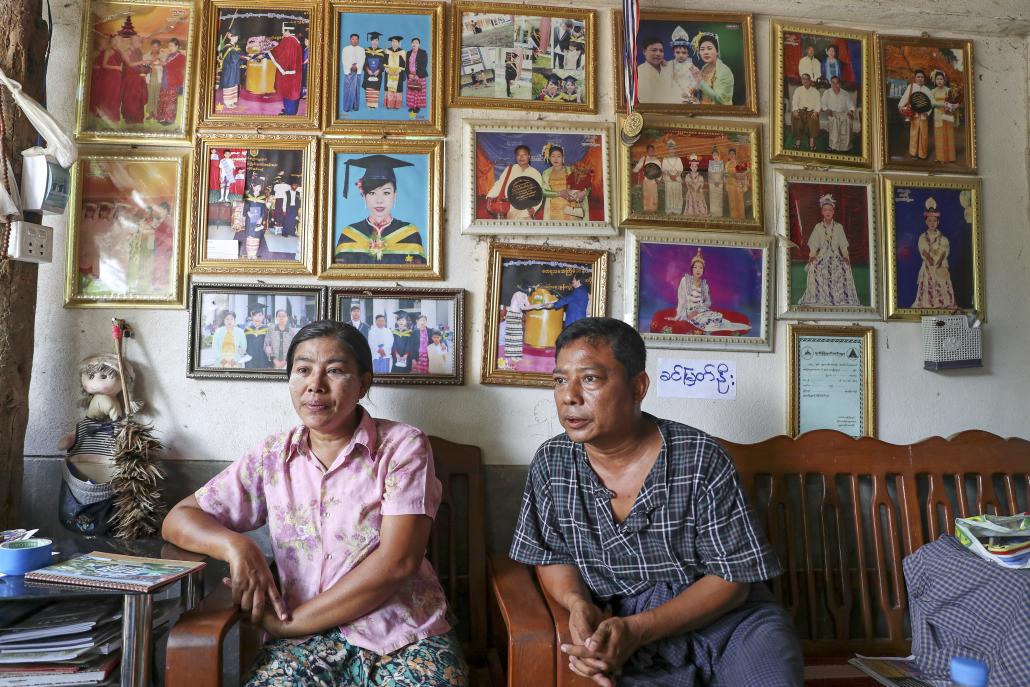 The parents of jailed plantation staff member Ma Shun Le Myat Noe, Daw Yi Win (Left) and U Myo Min Aung, at their home in Myotha West village. (Nyein Su Wai Kyaw Soe | Frontier)