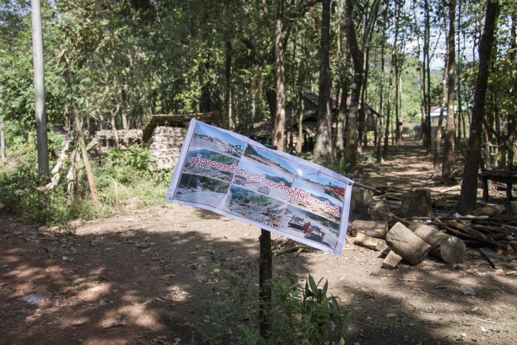 Many homes in Lun Nya have posted signs calling for an end to quarrying at Mount Lun Nya. (Nyein Su Wai Kyaw Soe | Frontier)