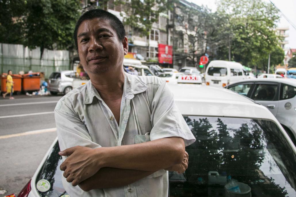 Taxi driver U Aung Htwe says he is considering signing up for a ride-hailing service. (Nyein Su Wai Kyaw Soe | Frontier)