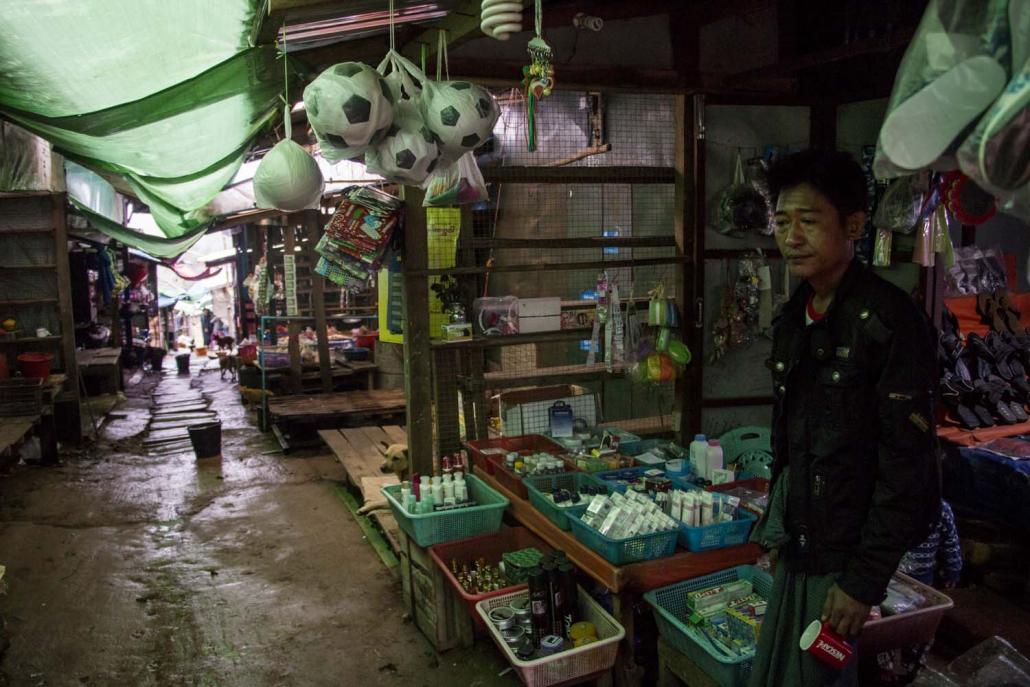 A vendor waits for customers in the market at Mine Myo. (Nyein Su Wai Kyaw Soe | Frontier)