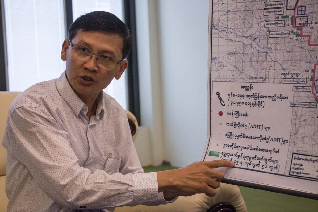 National Prosperity Company chairman U Soe Tun Shein points to a map of the mining concession. (Nyein Su Wai Kyaw Soe | Frontier)