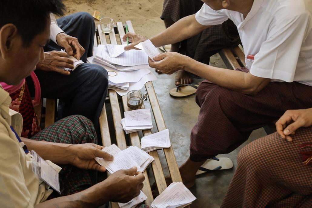 Officials count preliminary ballots at the Kyee Kan village polling station in Yangon’s Kawhmu Township. (Nyein Su Wai Kyaw Soe | Frontier)