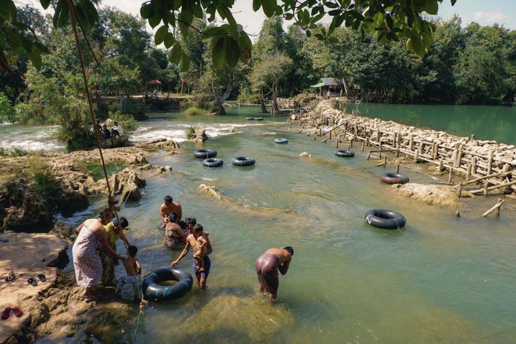 People wash by the water at Htee Sel Khar. (Dominic Horner | Frontier)