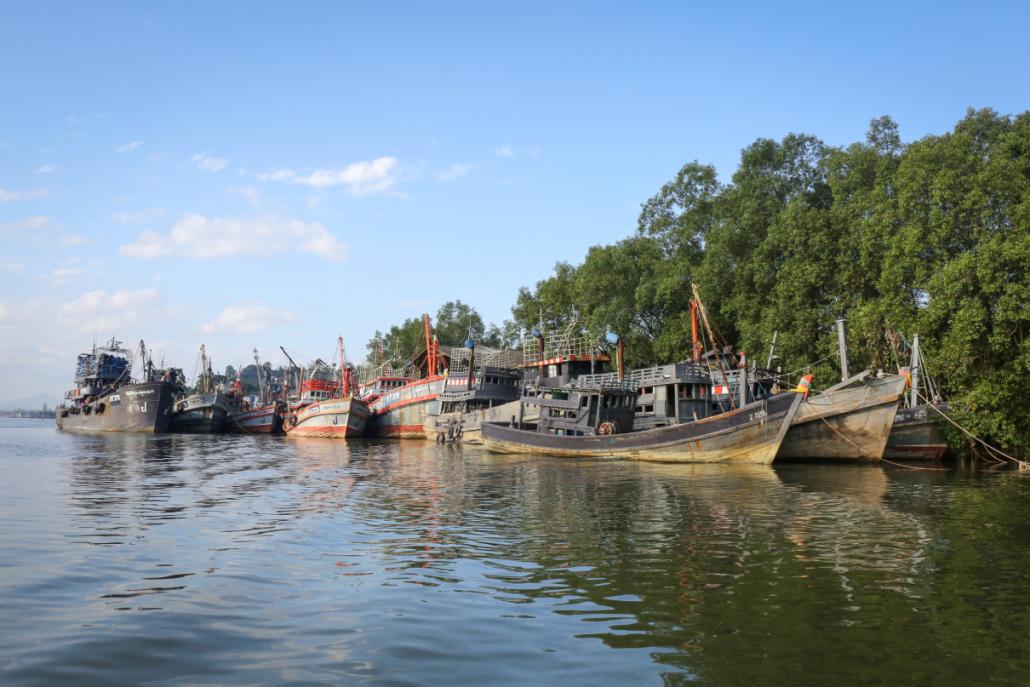 Boats moored in front of mangroves near Ranong. (Victoria Milko | Mongabay)