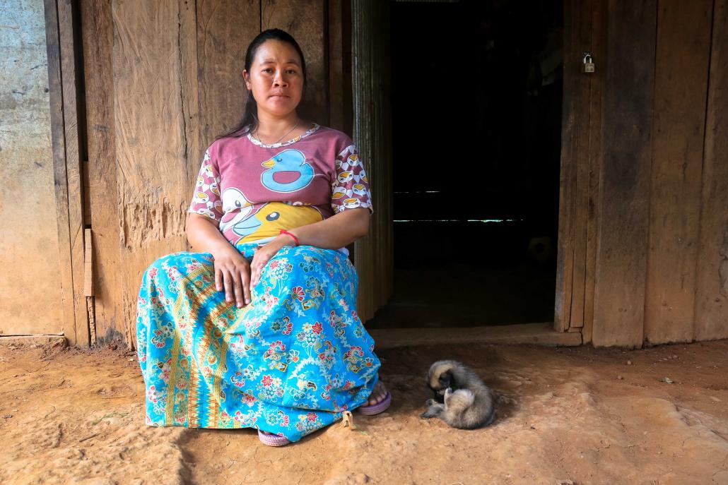 Loi Kaw Wan camp resident Si Tong, 29, sits in front of her home. Si Tong is pregnant with her third child and worries about getting enough food to keep her baby healthy. (Victoria Milko | Frontier)