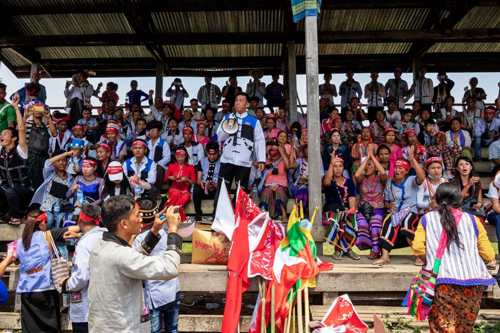 Lisu National Development Party chairman U Shwe Min holds a loudspeaker to address the demonstration in Myitkyina on June 3. (Phoe Shane | Frontier)