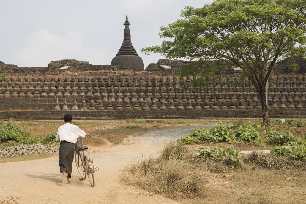 A local resident walks near the Kothaung temple in Mrauk-U, Rakhine State (Nyein Su Wai Kyaw Soe | Frontier)