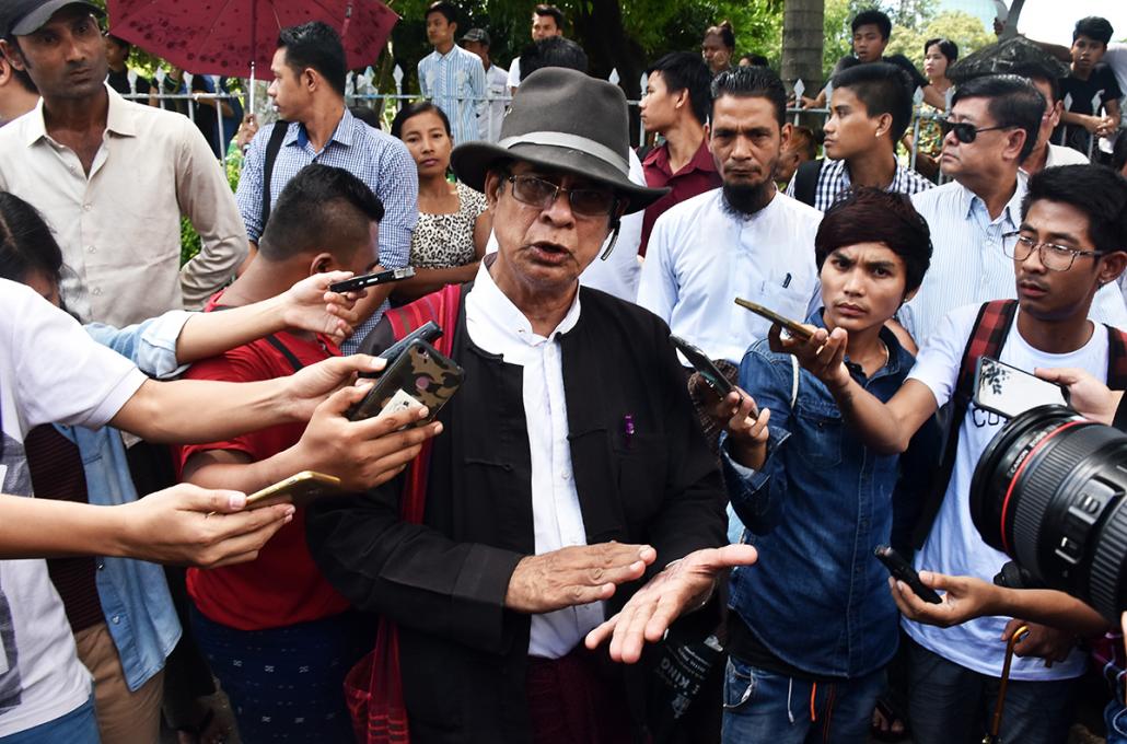 High Court lawyer U Robert San Aung talks to reporters outside the court. (Steve Tickner | Frontier)