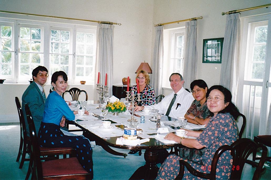 Trevor Wilson seated with Aung San Suu Kyi at the Australian ambassador's residence in Yangon's Golden Valley. (Trevor Wilson)