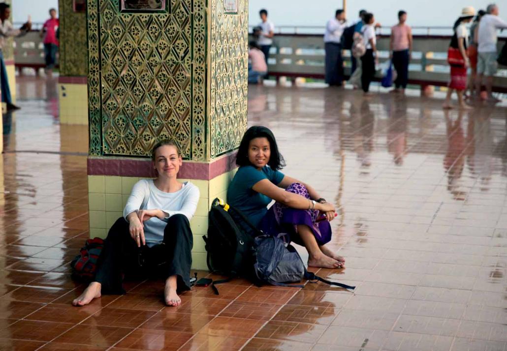 Kite Tales founders Kelly Macnamara and Thin Lei Win take a break from their work on Mandalay Hill. (Supplied)