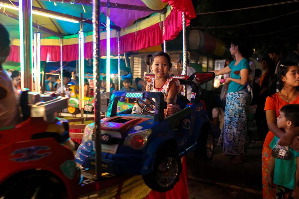 In some parts of Yangon, the Thadingyut full moon is celebrated with street festivals. (Victoria Milko | Frontier)
