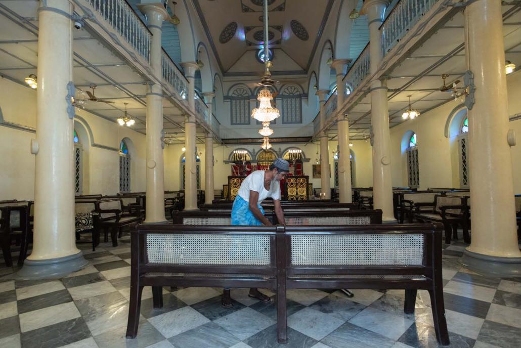 Each week before Shabbat, U Mahamed Esat, an elderly Indian-born Muslim, sweeps clean the Musmeah Yeshua Synagogue. (Rajiv Raman | Frontier) 